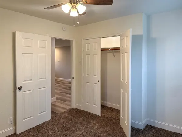 wooden floor in an empty room with a mirror