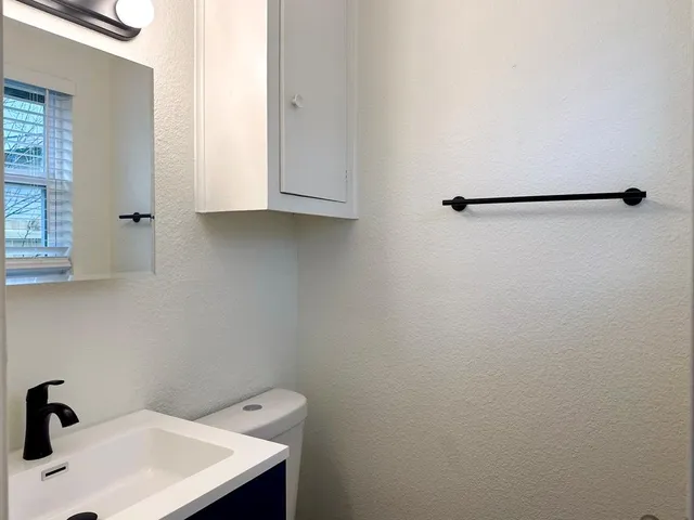 a bathroom with a sink and mirror