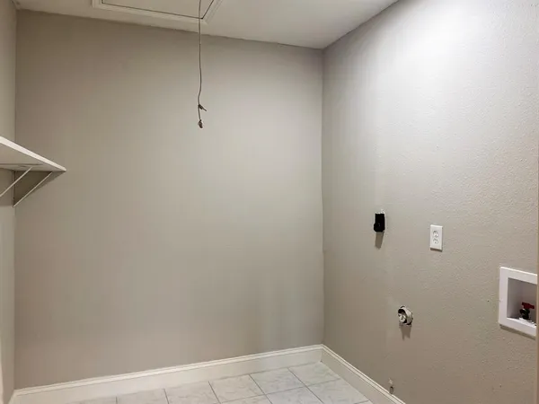 a view of a room with racks on the wall
