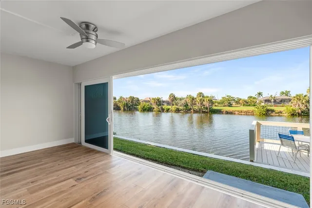 a bathroom with a granite countertop sink a toilet a mirror and shower