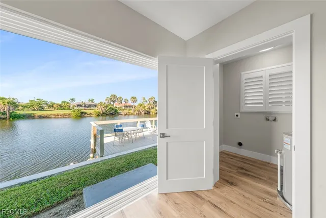 a bathroom with a toilet a sink a vanity and mirror