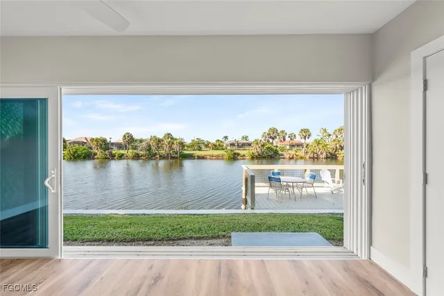 a view of kitchen with cabinets and wooden floor