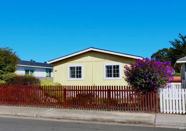 a view of a house with a garage