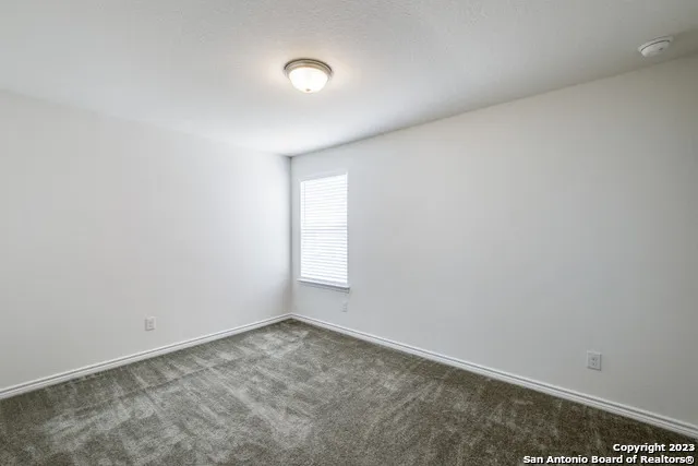 an empty room with a empty space and window