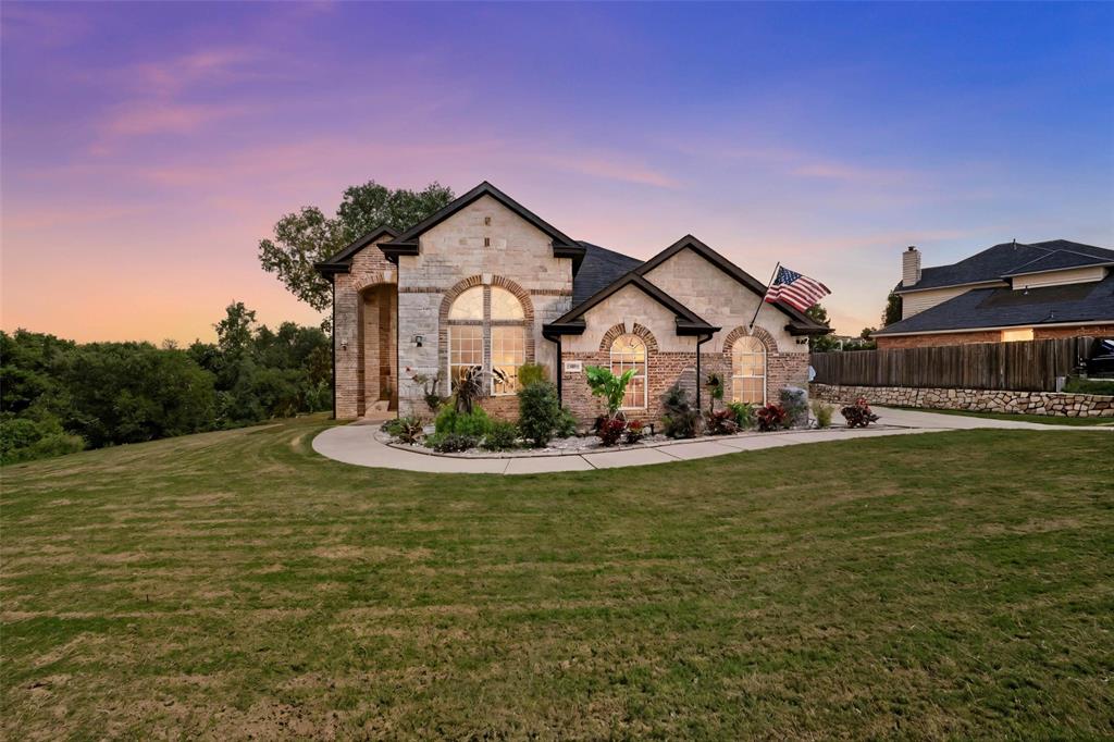 7408 Rocky Ford Road Fort Worth, TX 76179 - Photo 1 of 1 a front view of a house with garden