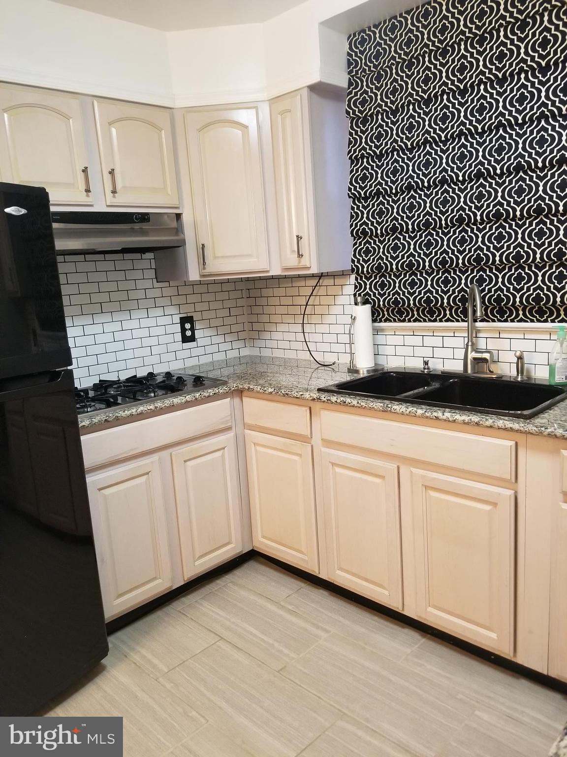 8200 Rugby Street Philadelphia, PA 19150 - Photo 9 of 19 Full Kitchen with Double Sink and Countertop Stove