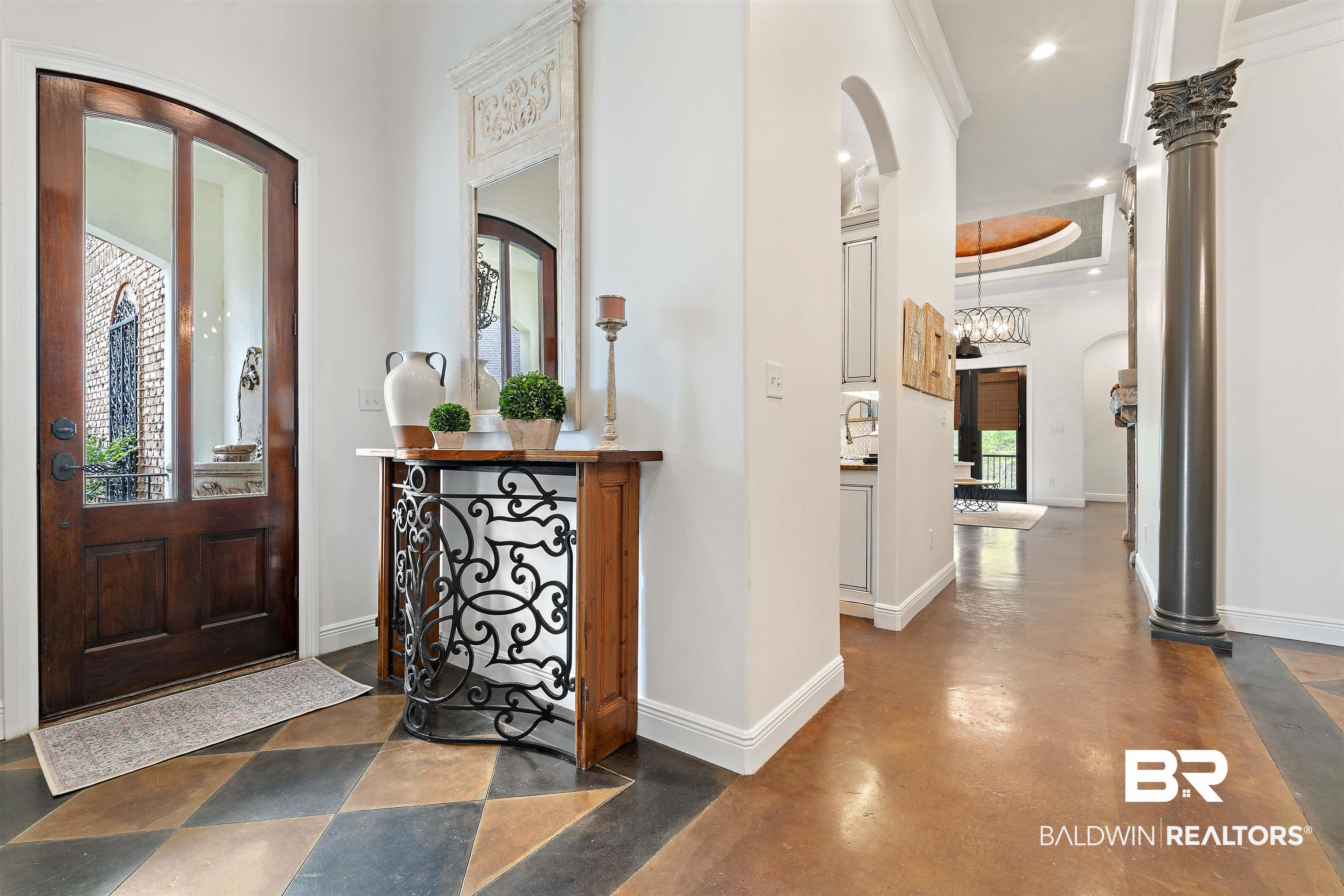 3584 Rue Royal Mobile, AL 36693 - Photo 4 of 35 Entryway with finished concrete flooring, baseboards, recessed lighting, arched walkways, and crown molding