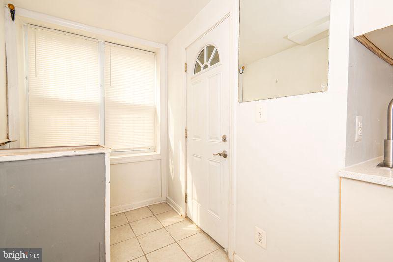 307 East 25th Street, Unit BASEMENT APARTMENT Baltimore, MD 21218 - Photo 16 of 21 view of bathroom with a shower and a door