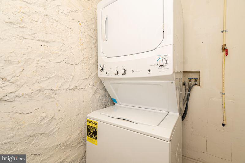 307 East 25th Street, Unit BASEMENT APARTMENT Baltimore, MD 21218 - Photo 17 of 21 a utility room with dryer and washer