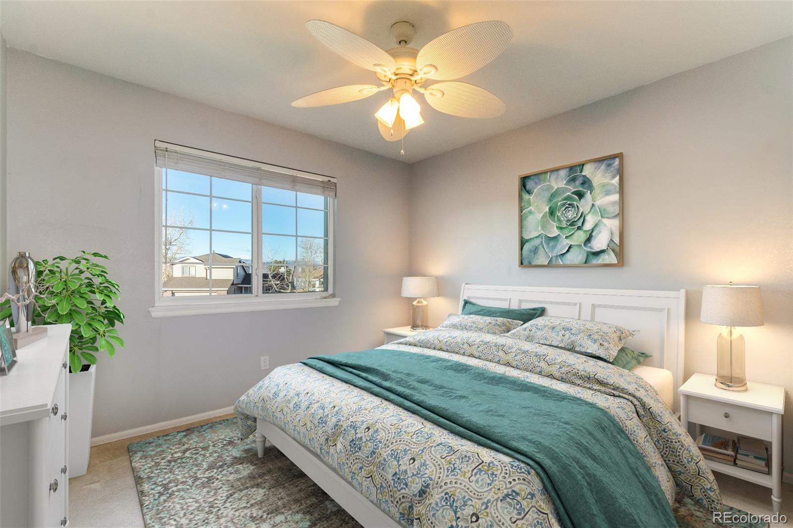 9164 Bitterweed Court Highlands Ranch, CO 80126 - Photo 13 of 27 a bedroom with a bed and a window
