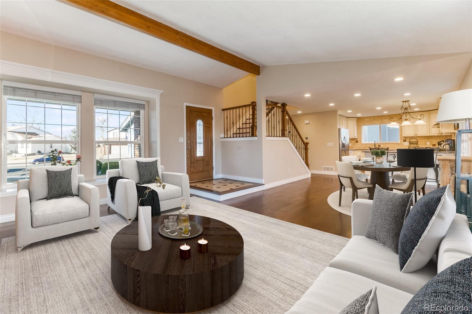 9164 Bitterweed Court Highlands Ranch, CO 80126 - Photo 5 of 27 a living room with furniture and a table