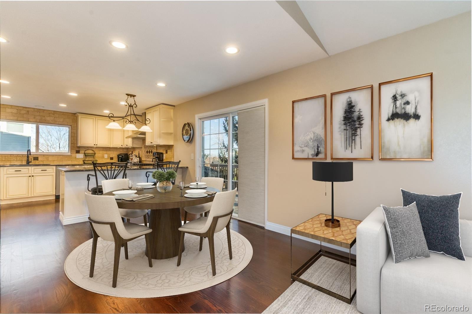 9164 Bitterweed Court Highlands Ranch, CO 80126 - Photo 6 of 27 a view of a dining room with furniture a chandelier and wooden floor