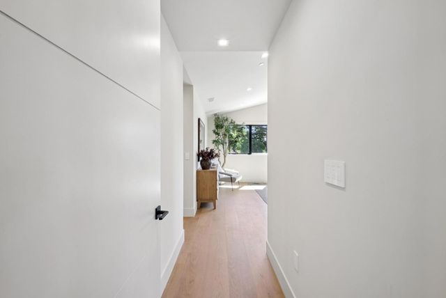 a bathroom with a sink vanity granite toilet and a shower