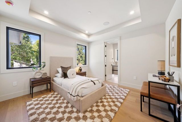 a view of a storage & utility room with refrigerator and rack
