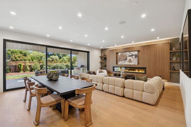 a kitchen with kitchen island a counter and chairs