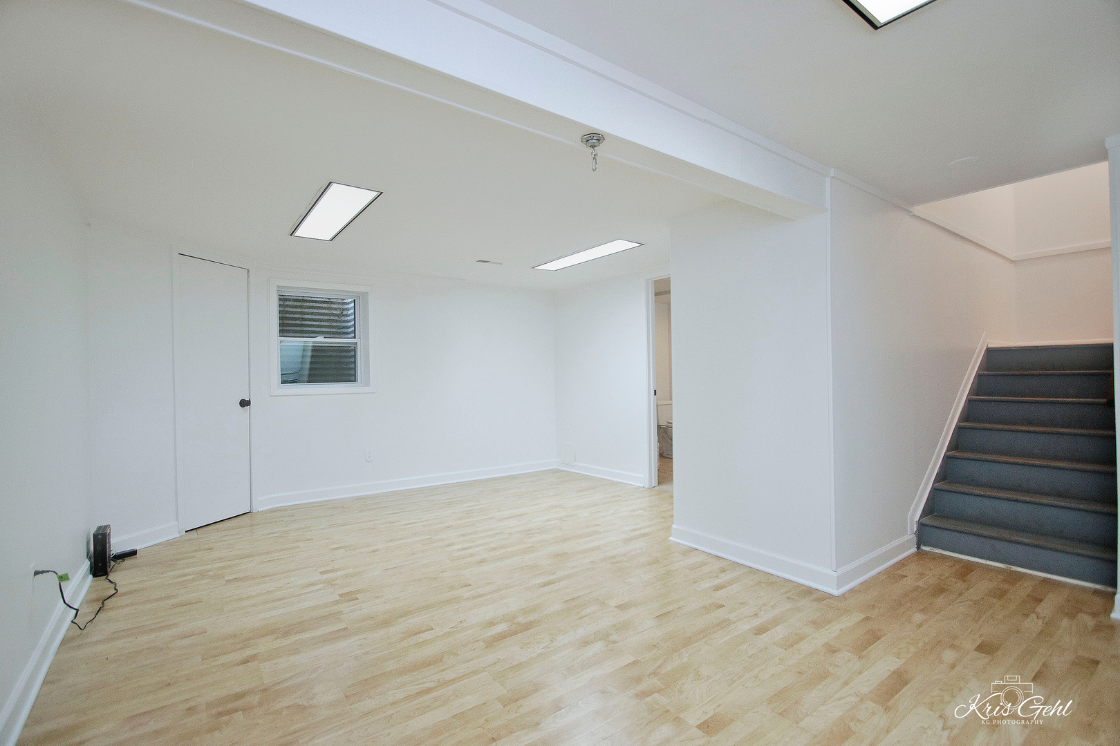 416 Arrow Trail, Unit 416 Wheeling, IL 60090 - Photo 15 of 24 a view of an empty room with wooden floor and stairs