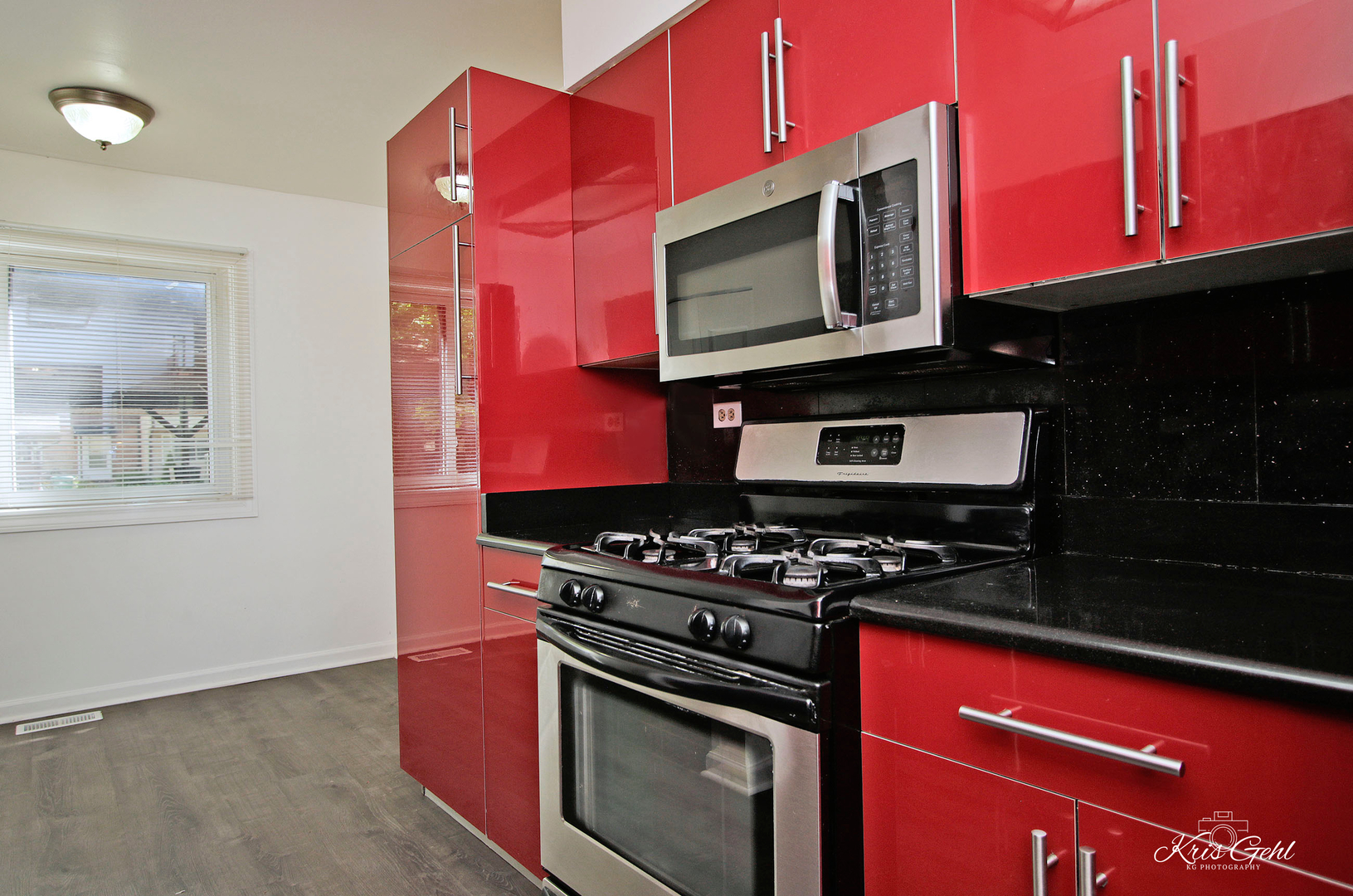 416 Arrow Trail, Unit 416 Wheeling, IL 60090 - Photo 7 of 24 a kitchen with stainless steel appliances a stove a microwave sink and cabinets
