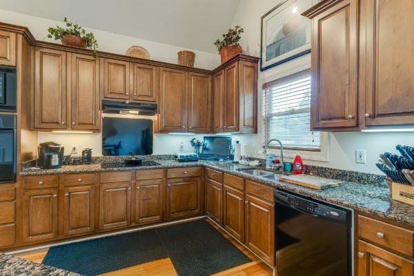 4664 New Cut Road Greenbrier, TN 37073 - Photo 7 of 85 a kitchen with stainless steel appliances granite countertop a sink stove and cabinets