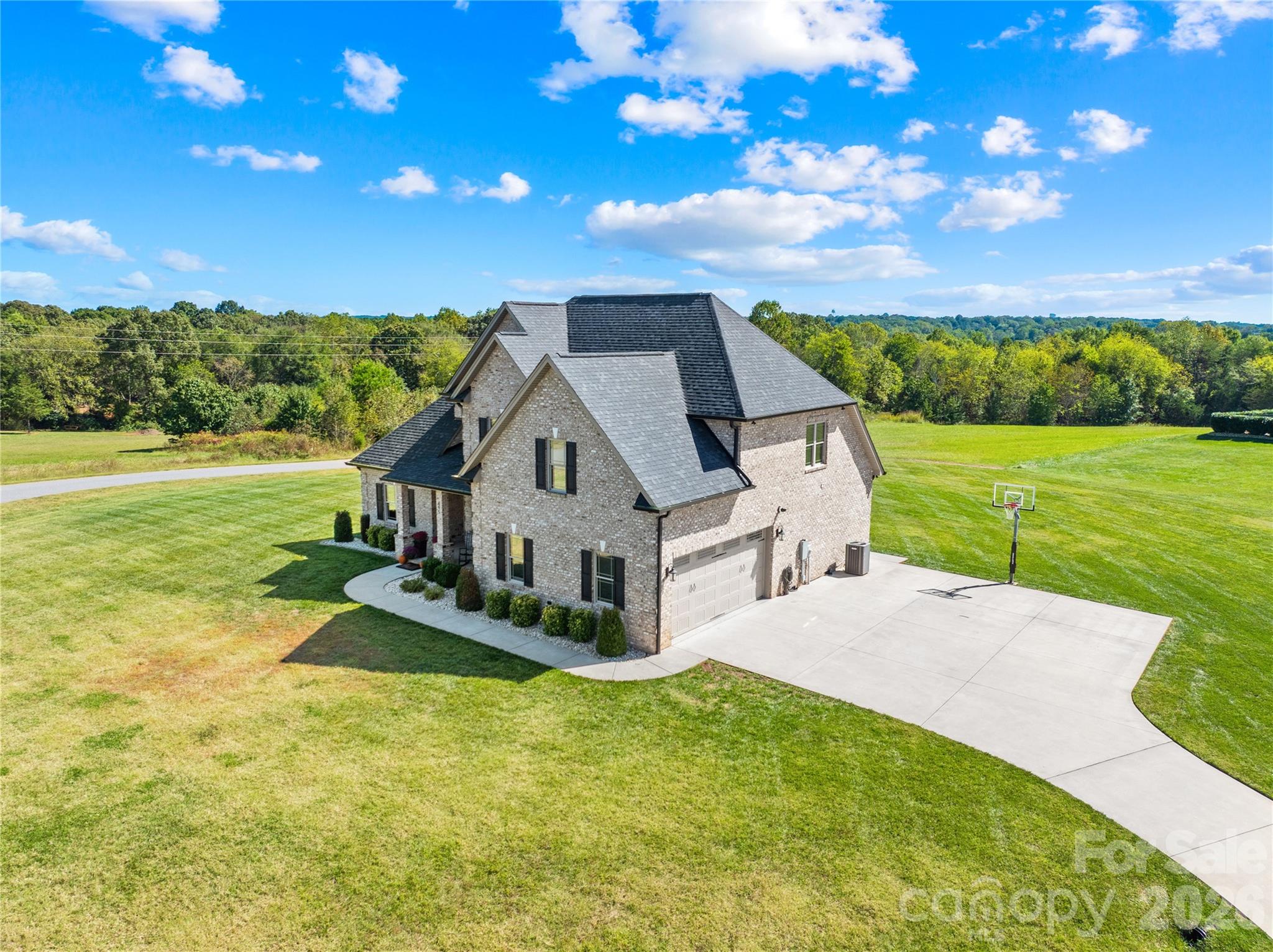 895 Oak Ridge Farms Circle Newton, NC 28658 - Photo 12 of 43 a front view of a house with a yard