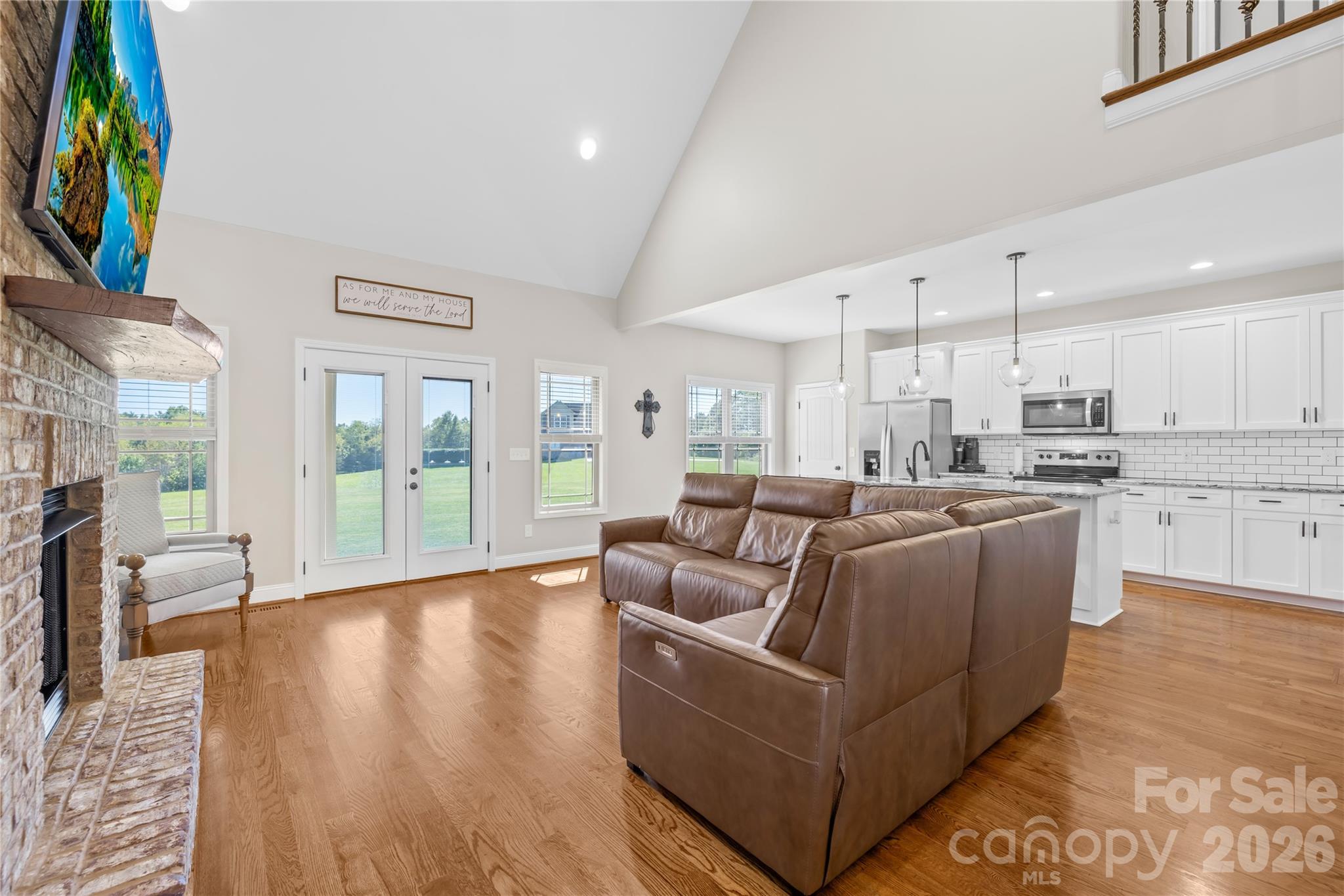 895 Oak Ridge Farms Circle Newton, NC 28658 - Photo 21 of 43 a living room with furniture and a floor to ceiling window