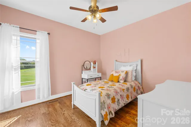 a bed room with a bed and a chandelier