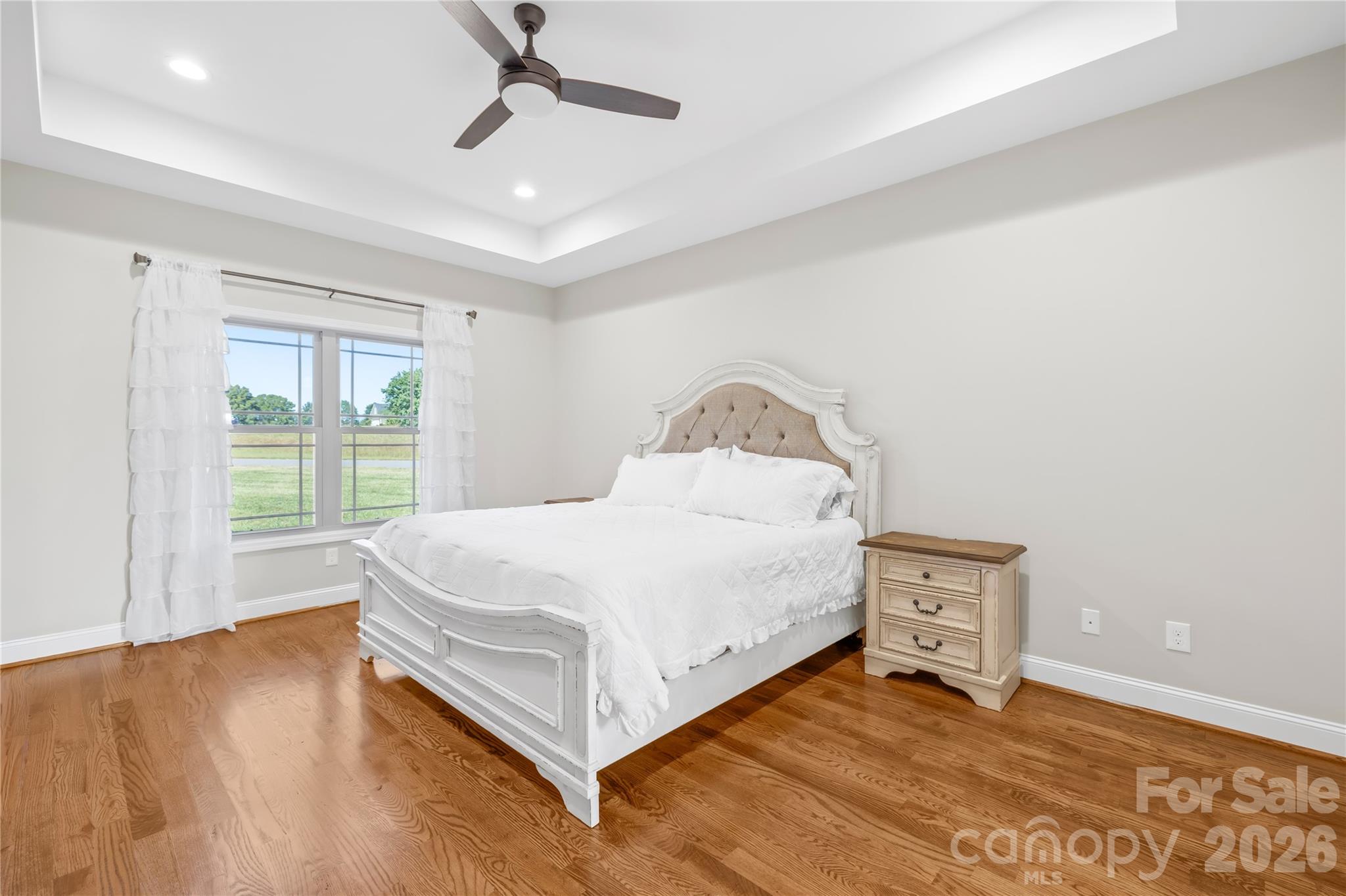895 Oak Ridge Farms Circle Newton, NC 28658 - Photo 27 of 43 a spacious bedroom with a bed and a window