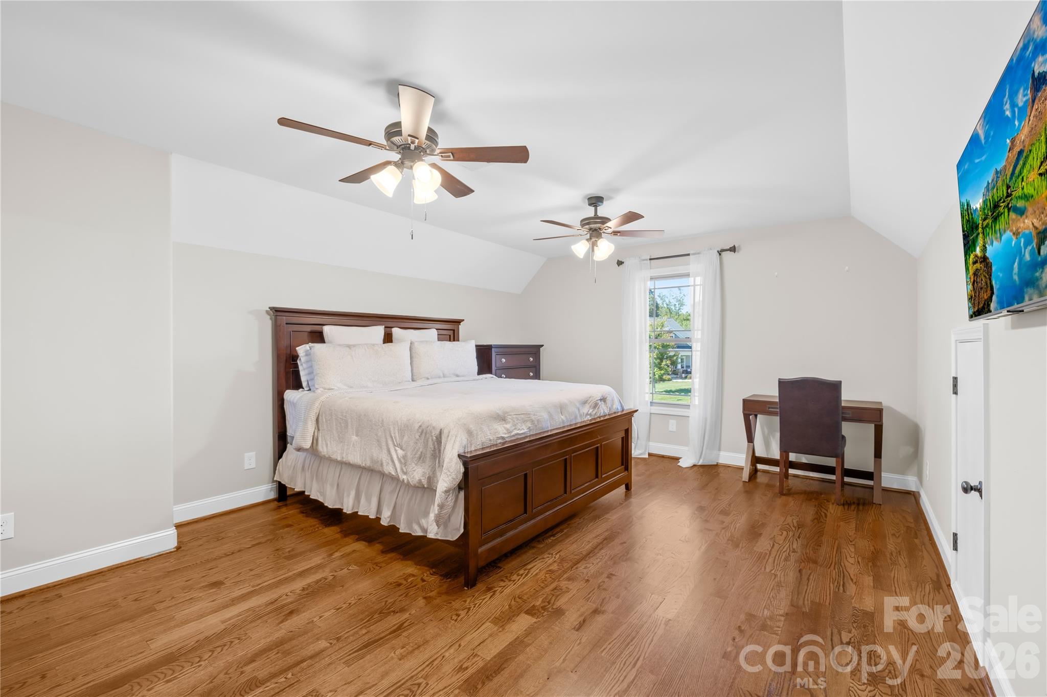 895 Oak Ridge Farms Circle Newton, NC 28658 - Photo 35 of 43 a bedroom with a bed and a chandelier