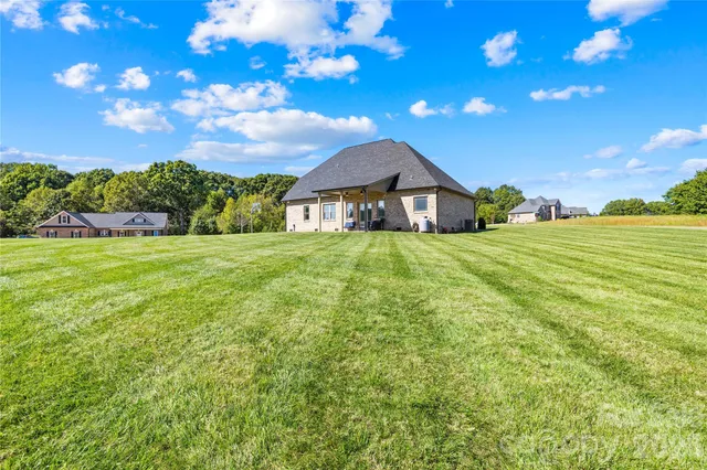 a view of a house with a big yard