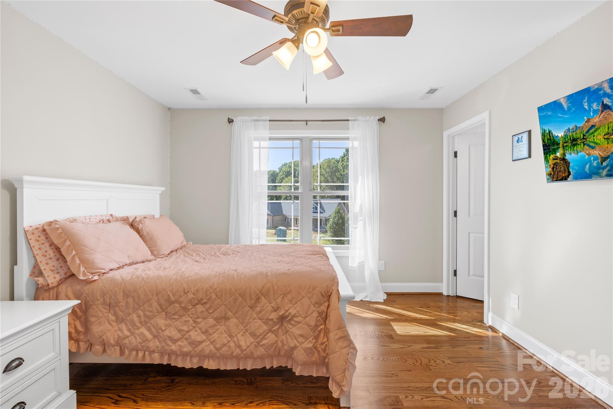 895 Oak Ridge Farms Circle Newton, NC 28658 - Photo 36 of 43 a bedroom with a bed and a chandelier