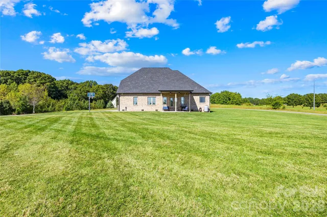 a view of a house with a big yard