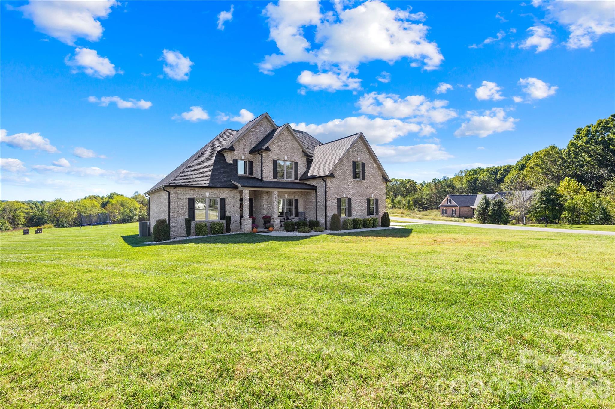 895 Oak Ridge Farms Circle Newton, NC 28658 - Photo 40 of 43 a front view of a house with a garden