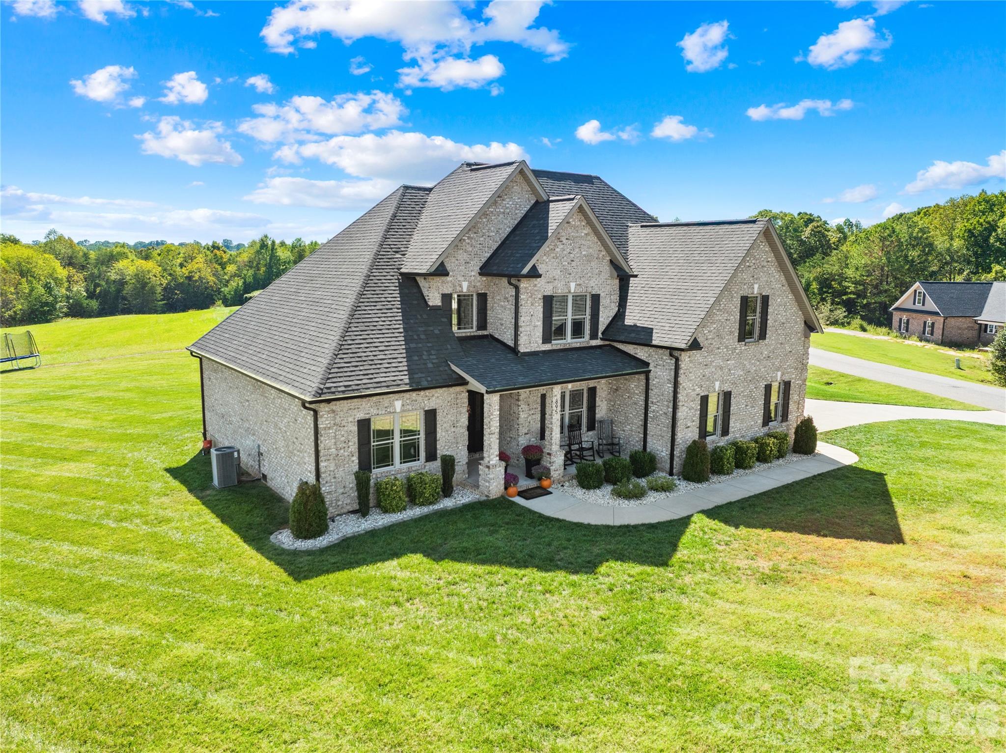 895 Oak Ridge Farms Circle Newton, NC 28658 - Photo 4 of 43 a front view of house with yard along with green space