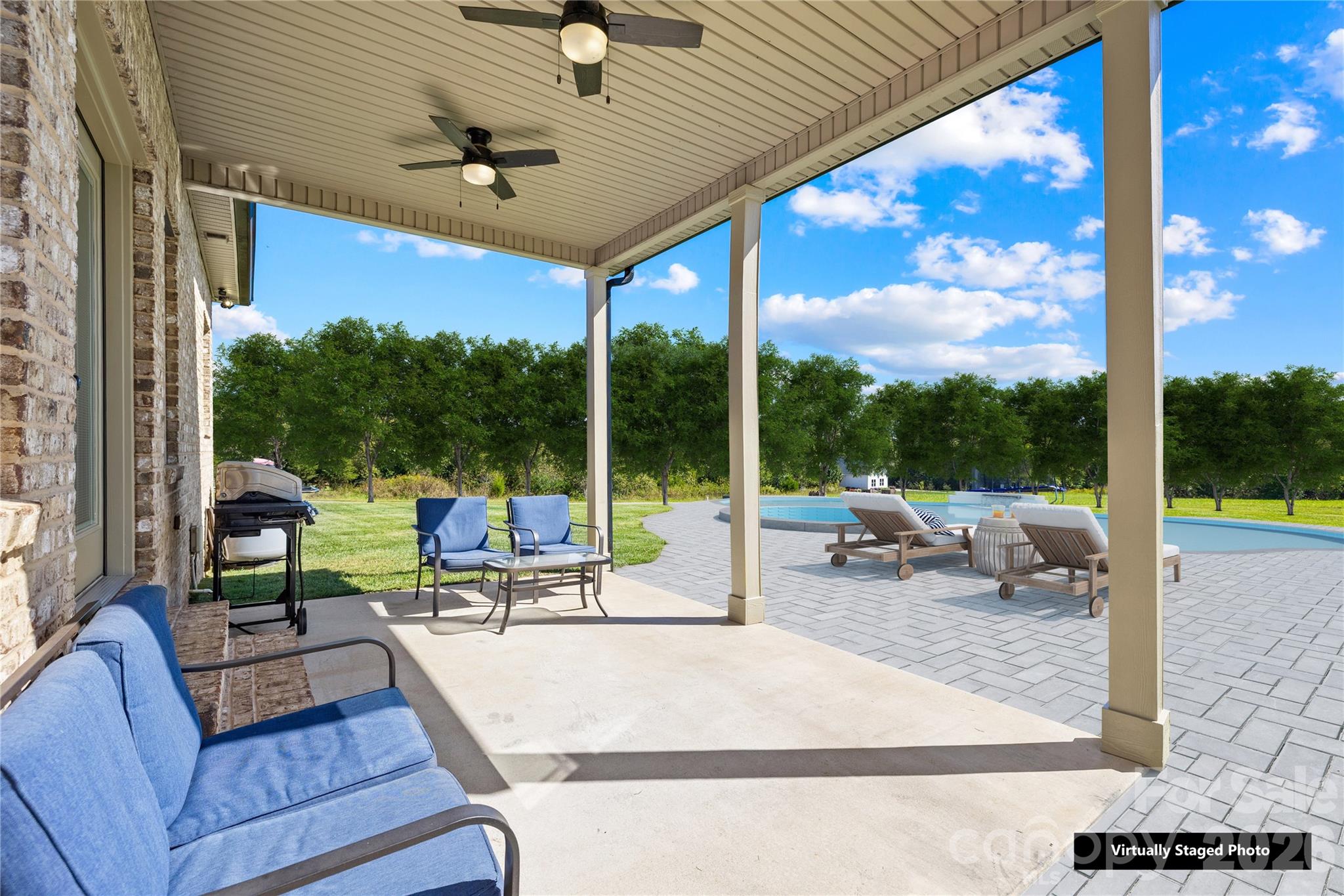 895 Oak Ridge Farms Circle Newton, NC 28658 - Photo 6 of 43 a view of a patio with a table chairs and a patio