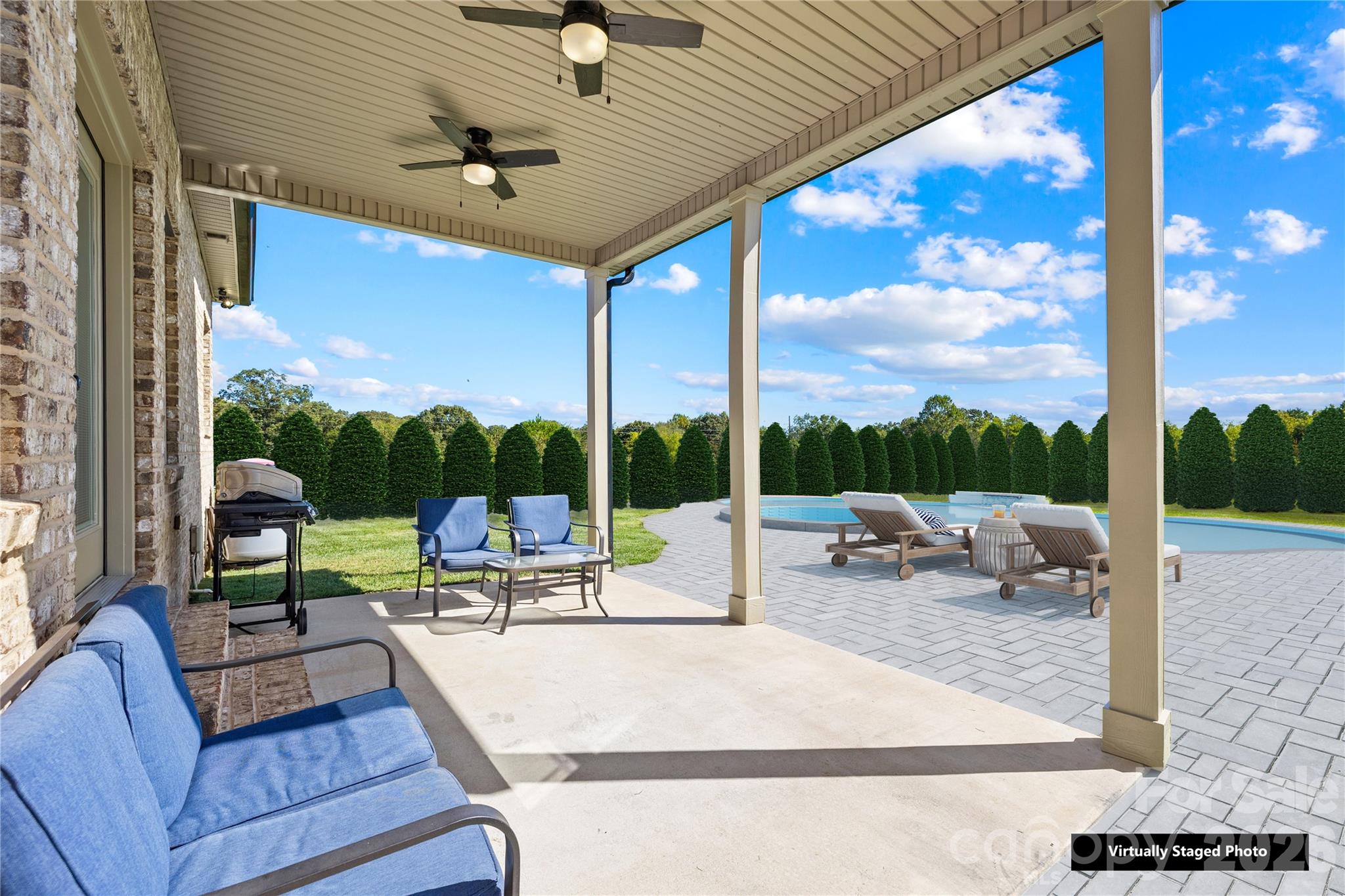 895 Oak Ridge Farms Circle Newton, NC 28658 - Photo 10 of 43 a view of a patio with a table chairs and a patio