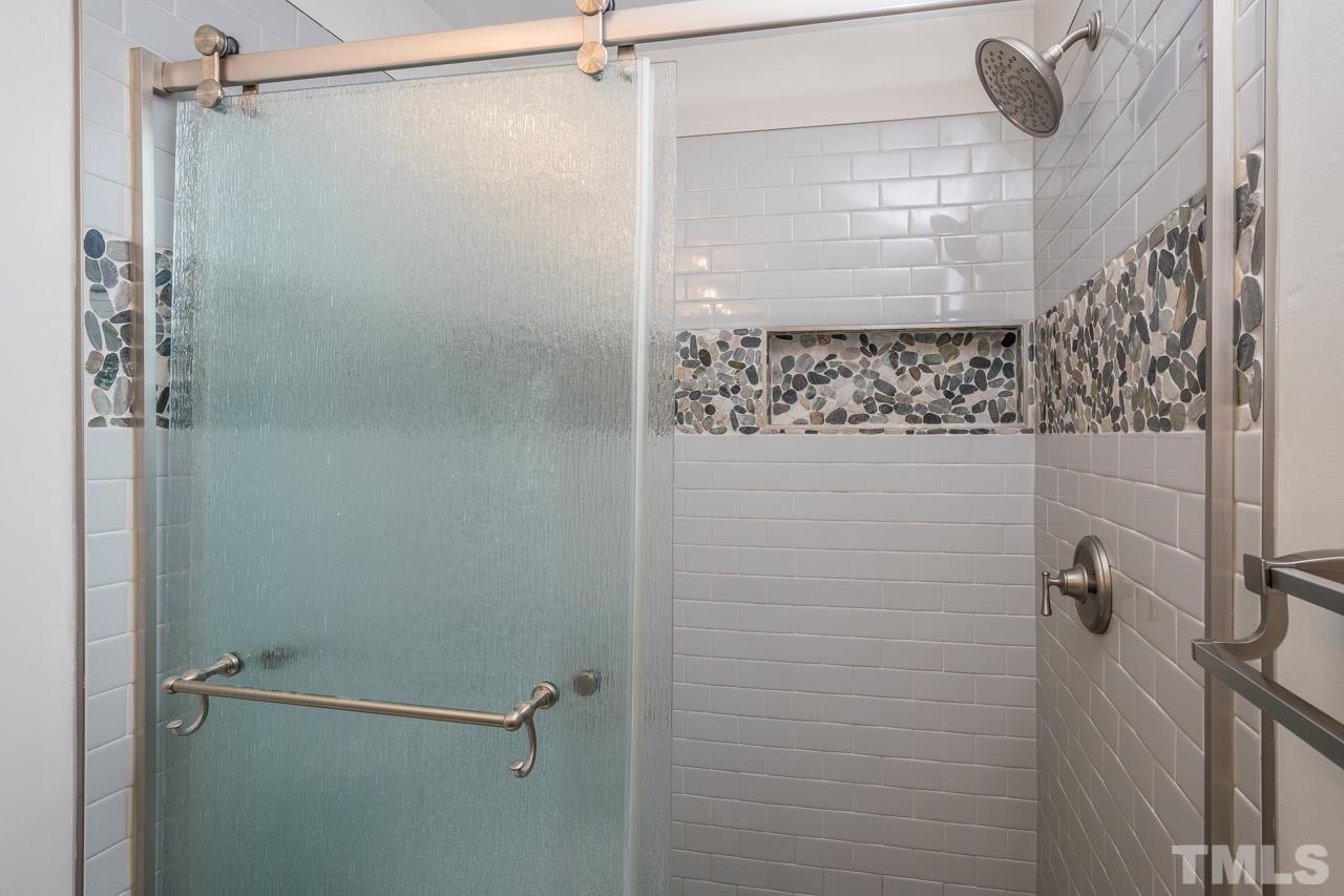 7244 Janston Drive Raleigh, NC 27613 - Photo 11 of 19 a bathroom with a shower
