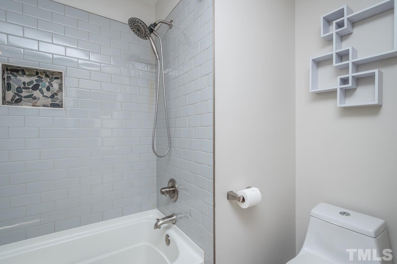 7244 Janston Drive Raleigh, NC 27613 - Photo 15 of 19 a bathroom with a shower