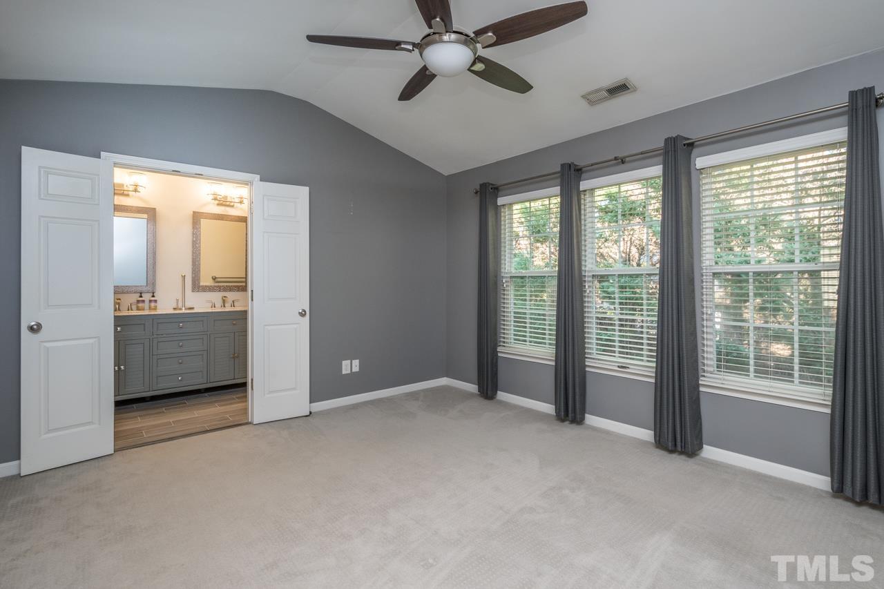 7244 Janston Drive Raleigh, NC 27613 - Photo 8 of 19 a view of an empty room with a window