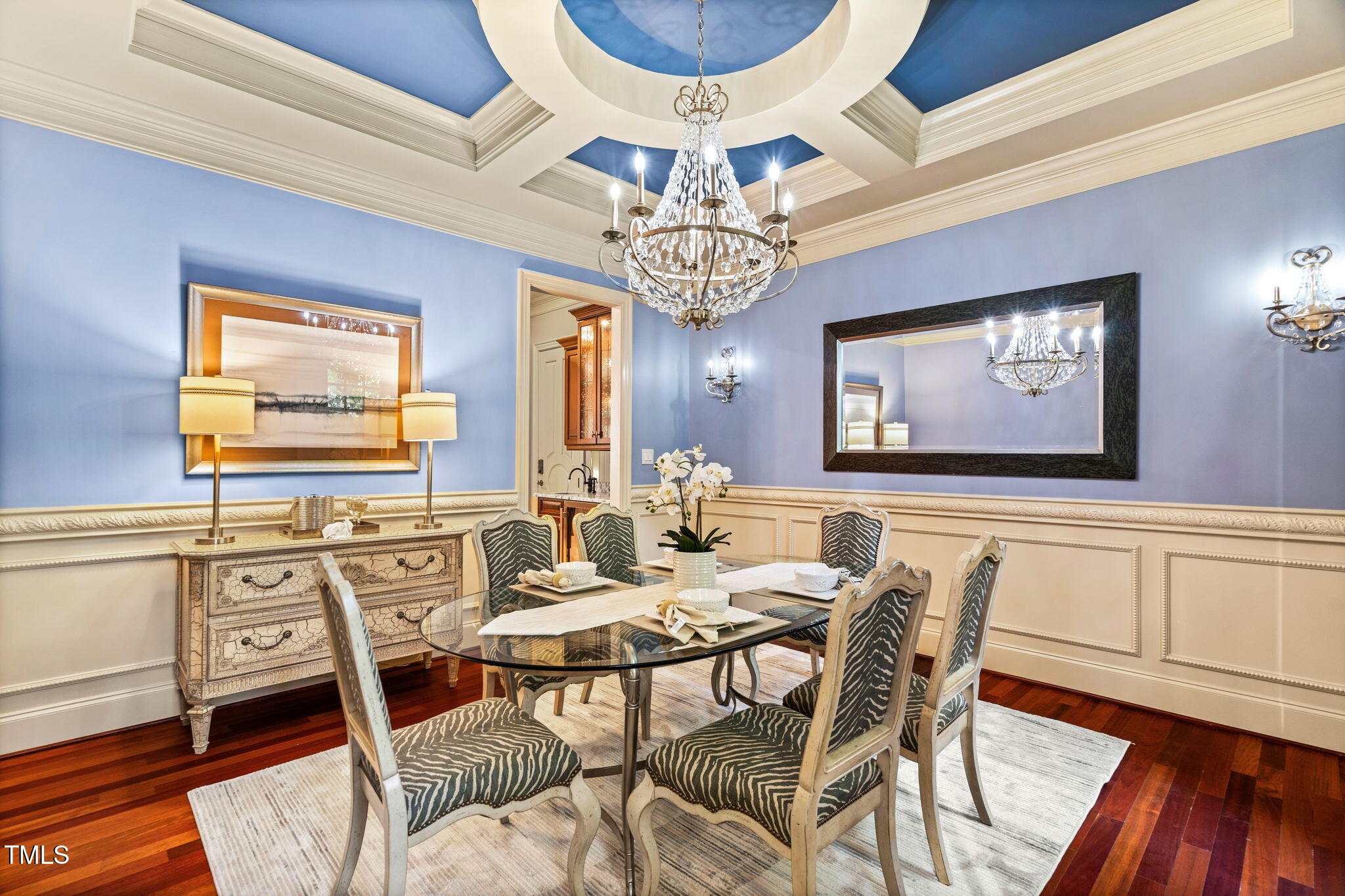 11201 Jonas Ridge Lane Raleigh, NC 27613 - Photo 17 of 79 Coffered ceiling with updated designer fixture center piece accenting elegant chandelier boasting 10” custom molding. Distinctive custom wainscoting and chair rail detailing
