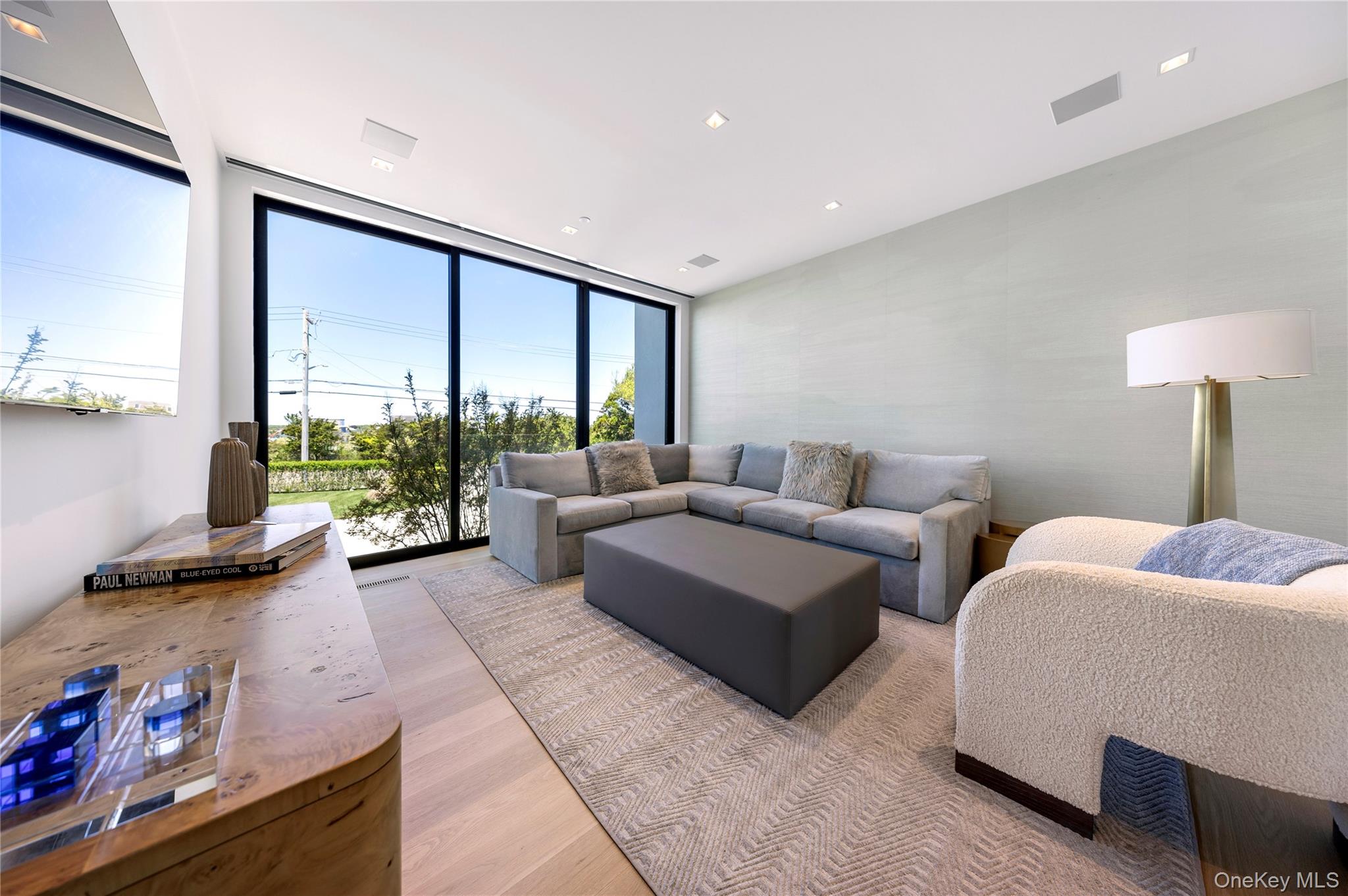 345 Dune Road Westhampton Beach, NY 11978 - Photo 11 of 34 a living room with furniture and a large window