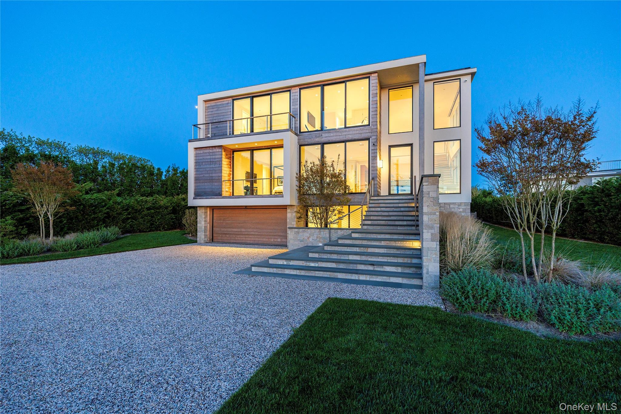 345 Dune Road Westhampton Beach, NY 11978 - Photo 31 of 34 a front view of a house with a yard