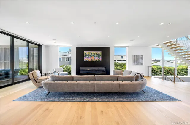 a living room with furniture window and wooden floor