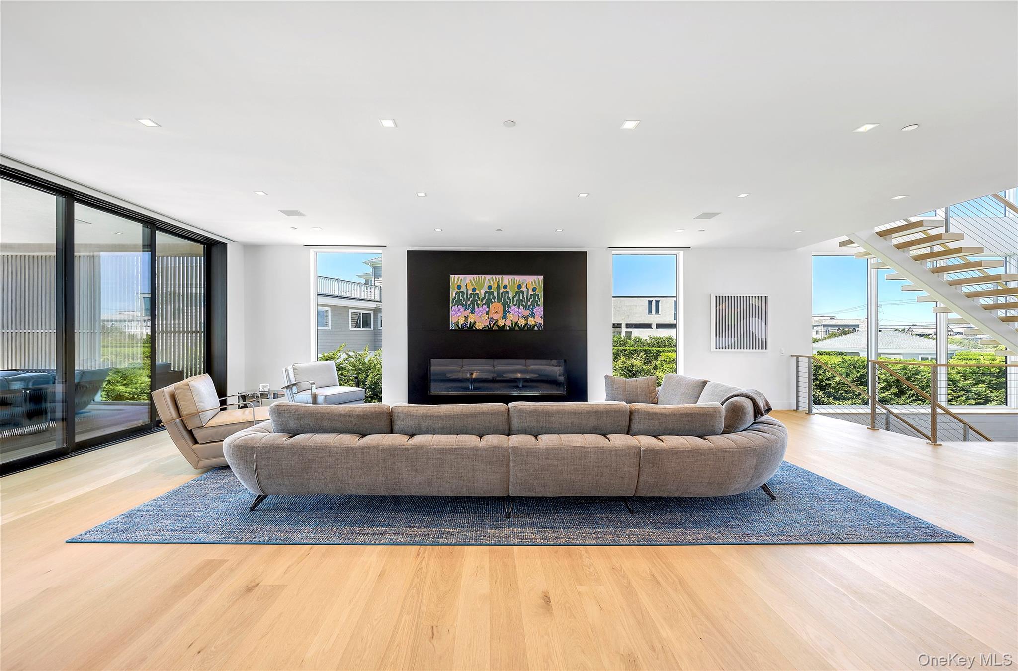 345 Dune Road Westhampton Beach, NY 11978 - Photo 5 of 34 a living room with furniture window and wooden floor