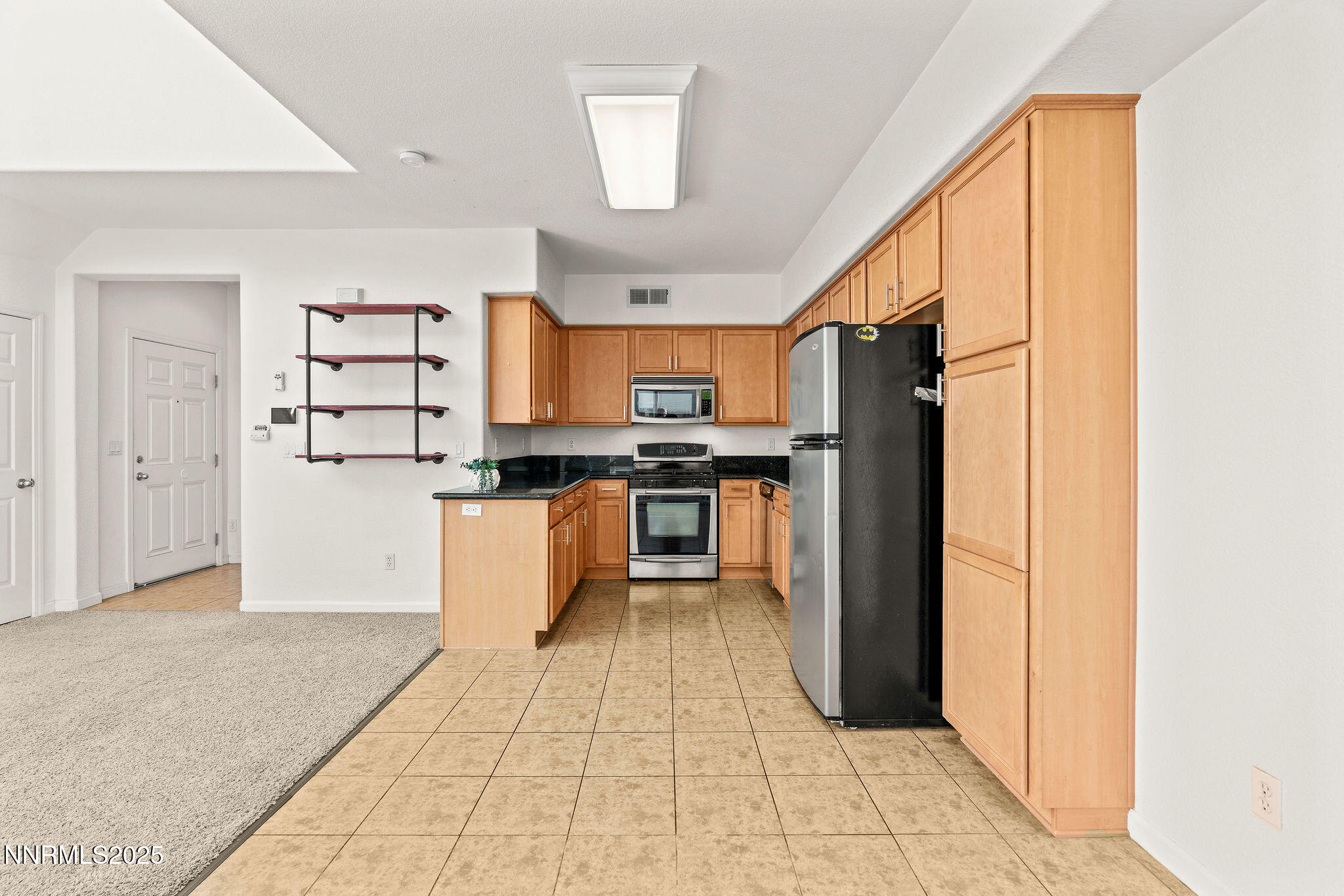 2125 Stanton Lane Reno, NV 89502 - Photo 13 of 48 a kitchen with stainless steel appliances granite countertop a refrigerator and a stove