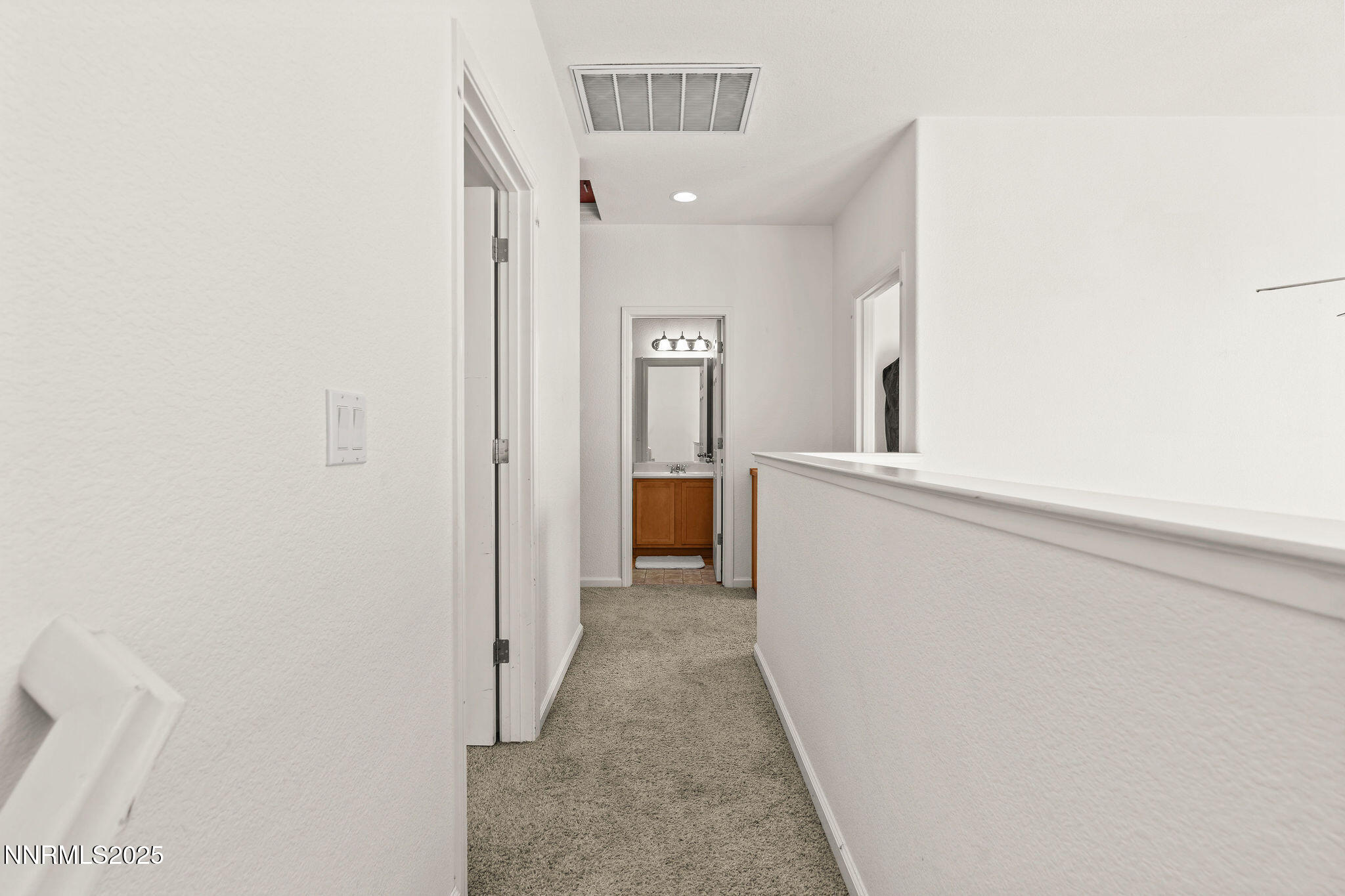 2125 Stanton Lane Reno, NV 89502 - Photo 16 of 48 a view of a hallway with wooden floor and a bathroom
