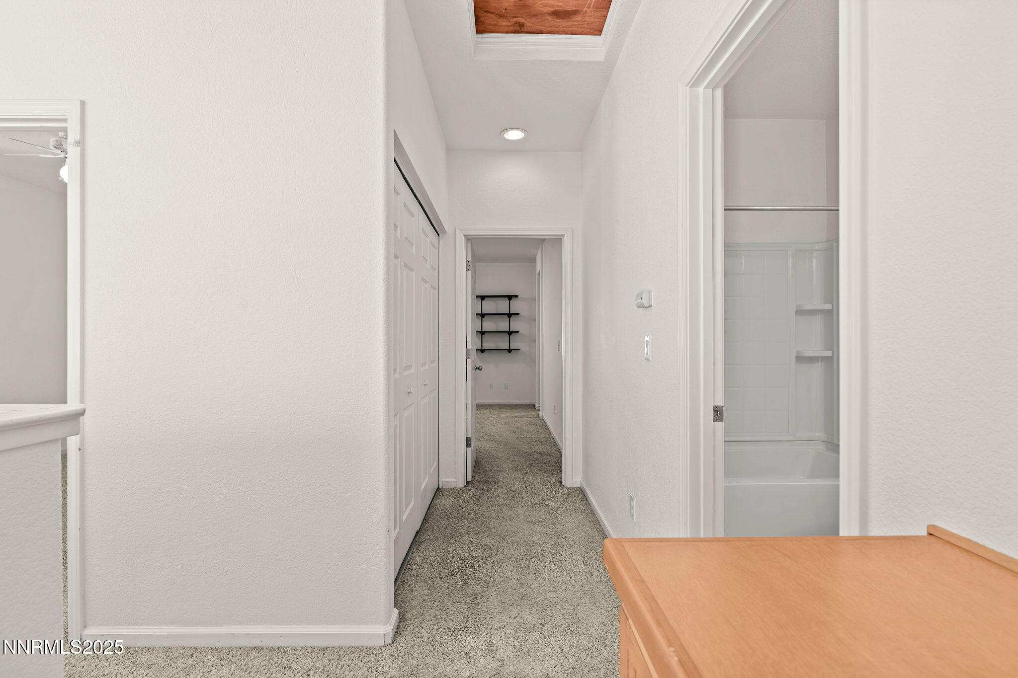 2125 Stanton Lane Reno, NV 89502 - Photo 17 of 48 a view of a hallway with wooden shelves