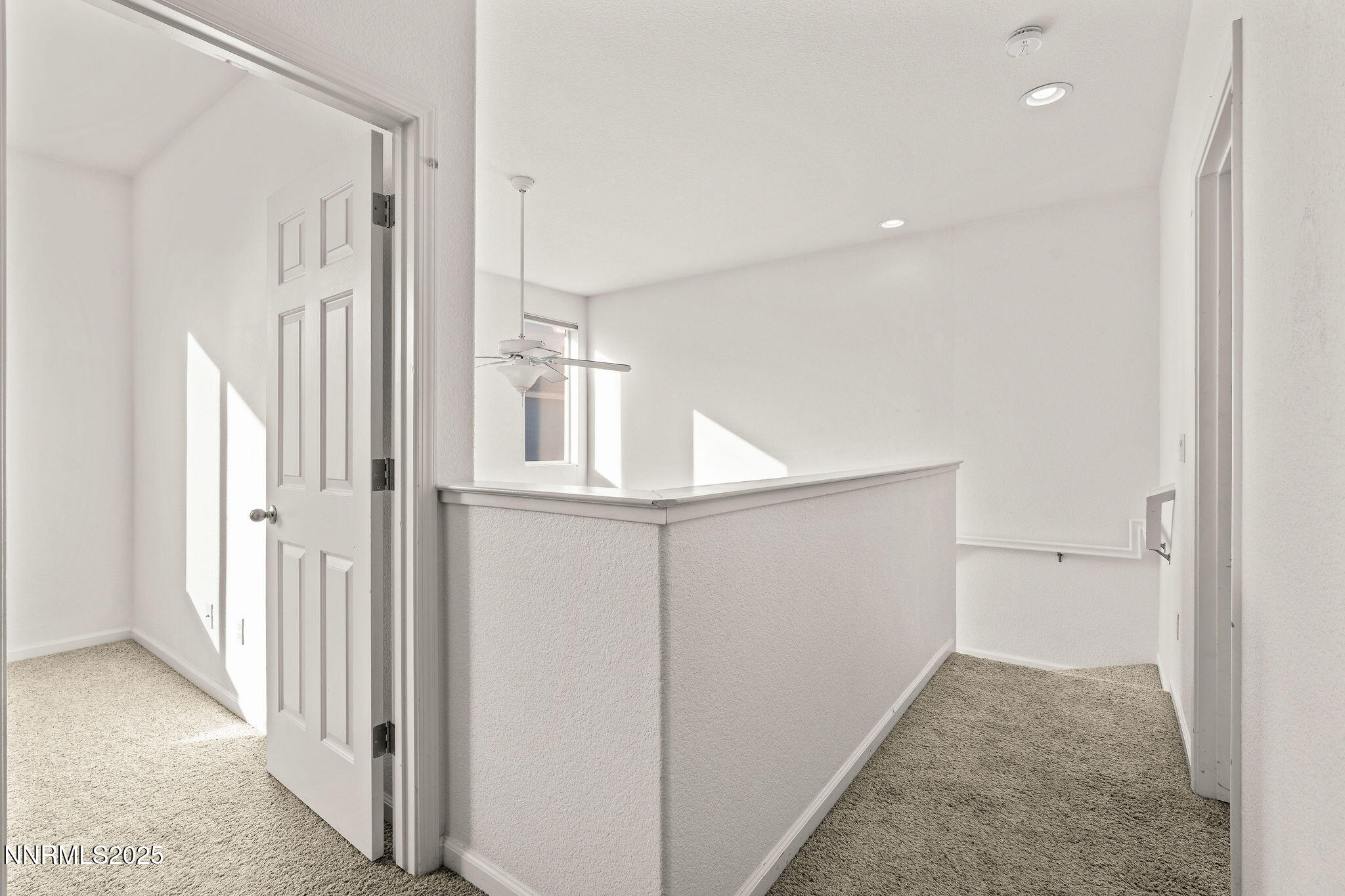 2125 Stanton Lane Reno, NV 89502 - Photo 19 of 48 a view of a hallway with white walls and entryway