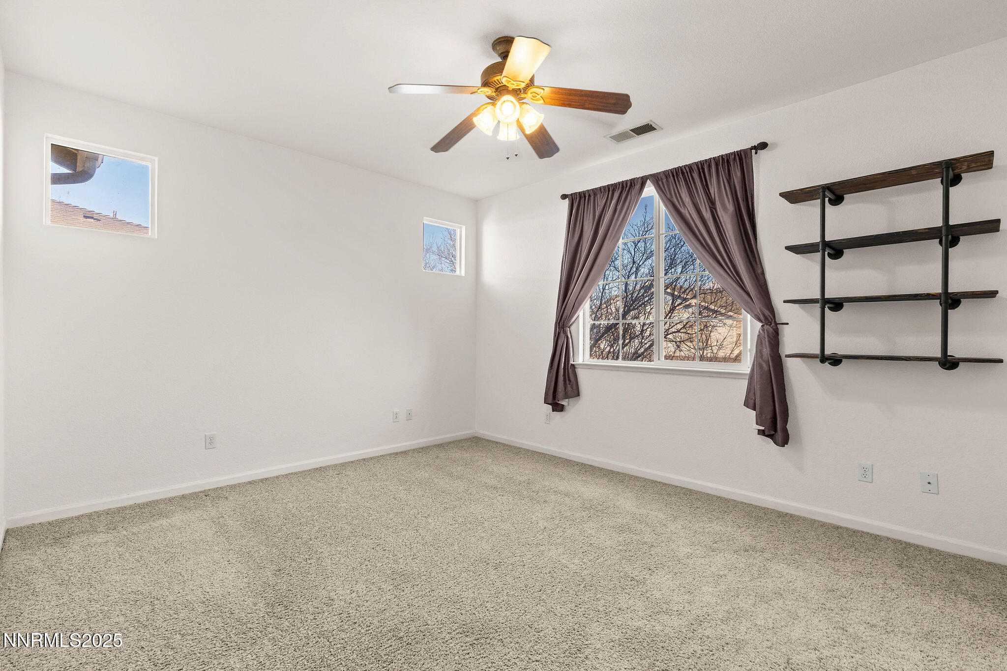2125 Stanton Lane Reno, NV 89502 - Photo 20 of 48 an empty room with windows and fan