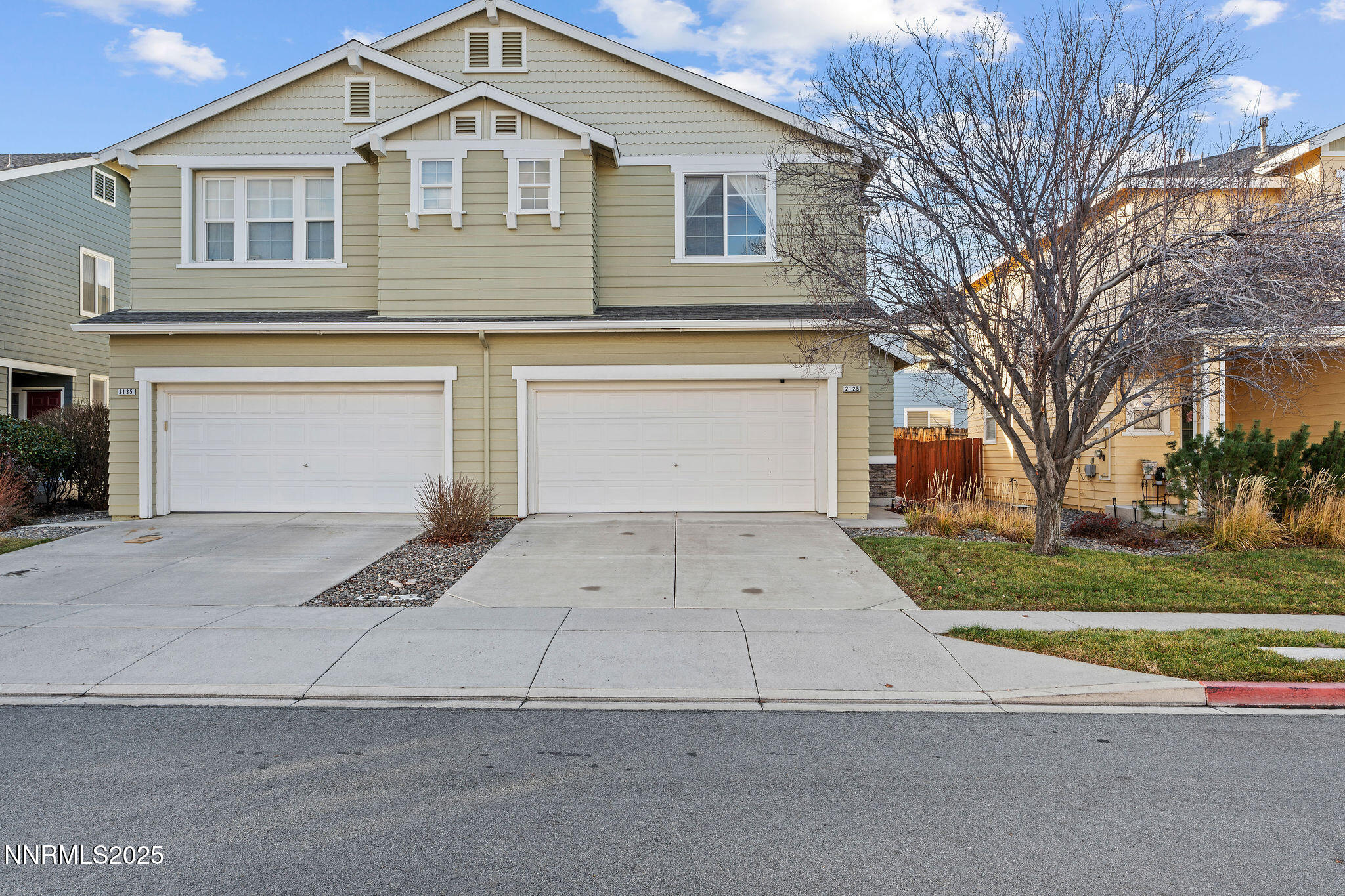 2125 Stanton Lane Reno, NV 89502 - Photo 2 of 48 a front view of a house with a yard and garage