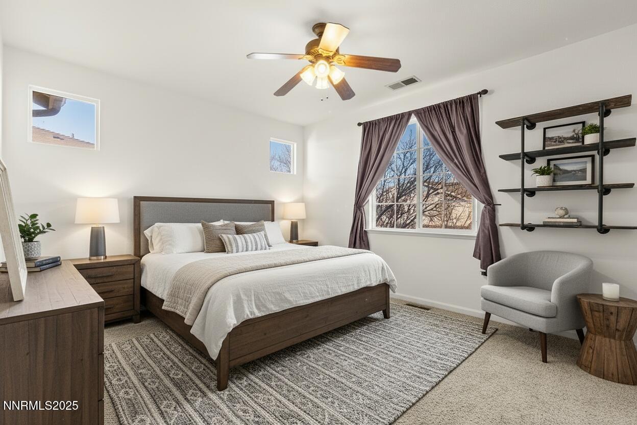 2125 Stanton Lane Reno, NV 89502 - Photo 21 of 48 a bedroom with a bed and a couch