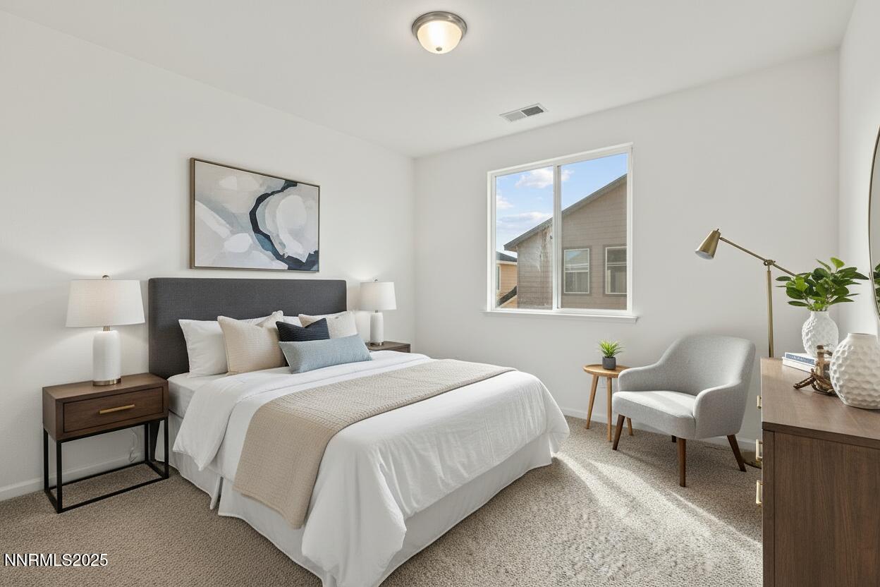 2125 Stanton Lane Reno, NV 89502 - Photo 28 of 48 a bedroom with a bed a couch and window